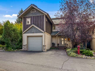 Discover this charming townhome featuring a two-car garage and a welcoming front porch.
