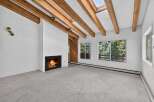 Experience the warmth and charm of this inviting living space, featuring a cozy fireplace perfect for chilly evenings.