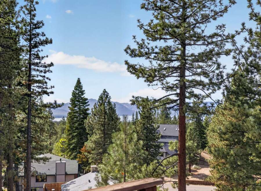 Experience breathtaking lake and mountain views from this stunning property, nestled amongst mature pine trees.