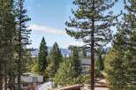 Experience breathtaking lake and mountain views from this stunning property, nestled amongst mature pine trees.