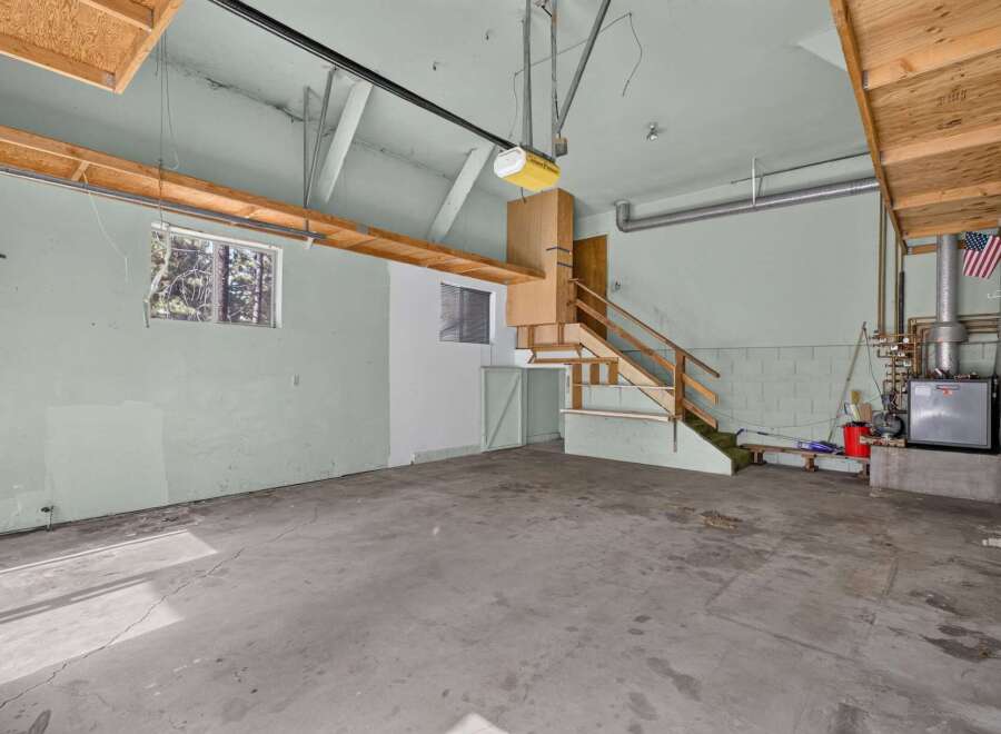 Discover the potential of this spacious garage, perfect for storage or a workshop.