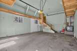 Discover the potential of this spacious garage, perfect for storage or a workshop.