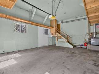 Discover the potential of this spacious garage, perfect for storage or a workshop.