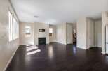 Step into this spacious living area featuring a modern fireplace as the focal point, perfect for cozy evenings.