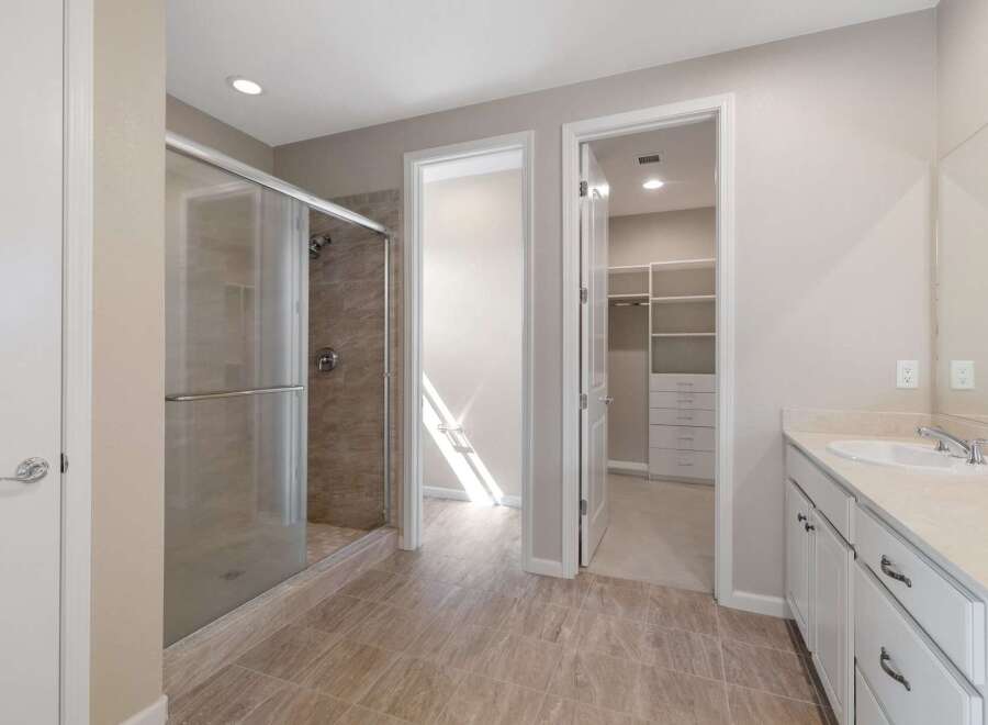 Step into this luxurious bathroom featuring a spacious glass-enclosed shower with elegant tilework.