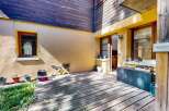 Enjoy outdoor living on this charming wooden deck, perfect for relaxing or entertaining.