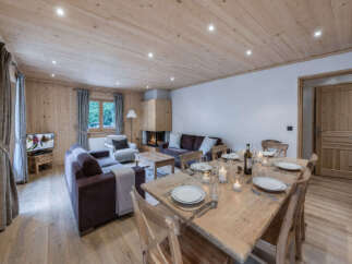 Experience rustic charm and modern comfort in this beautifully appointed living and dining area.