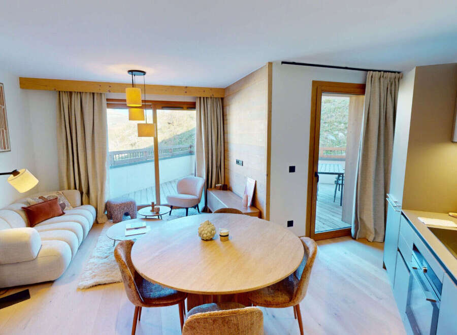 Experience modern alpine living in this beautifully appointed apartment, featuring a spacious open-plan living and dining area perfect for entertaining.