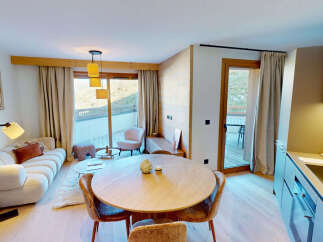 Experience modern alpine living in this beautifully appointed apartment, featuring a spacious open-plan living and dining area perfect for entertaining.