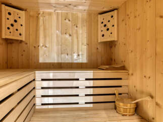 Experience ultimate relaxation in this beautifully crafted wooden sauna.