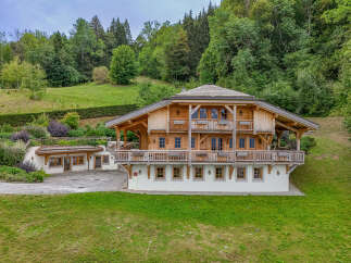 Experience luxury mountain living in this stunning wooden chalet, nestled amidst lush green hills and dense forests.