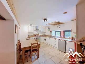 Discover this charming kitchen and dining area, perfect for family gatherings.