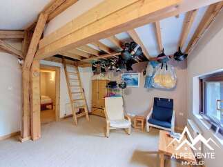 Discover this charming property featuring a unique loft space accessible by a wooden ladder, perfect for storage or an additional sleeping area.