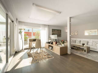 Experience modern living in this spacious apartment featuring a bright and airy living area with large windows and a private balcony.
