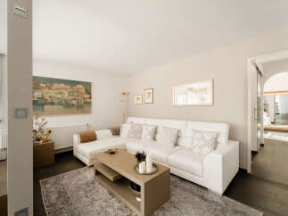 Experience modern living in this beautifully appointed living room, featuring a plush white sectional sofa perfect for relaxation and entertaining.