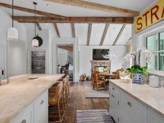 Experience rustic charm and modern elegance in this stunning kitchen and dining area.