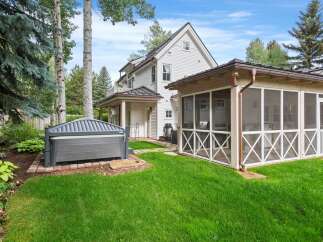 Enjoy outdoor living with this property's luxurious hot tub, perfect for relaxation.