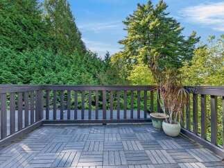 Enjoy the outdoors from this spacious deck, perfect for entertaining or relaxing.