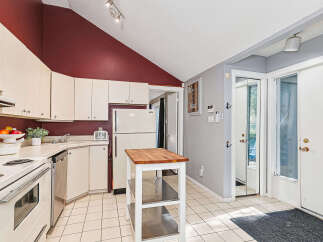 Discover this charming kitchen featuring ample cabinet space and a functional layout.