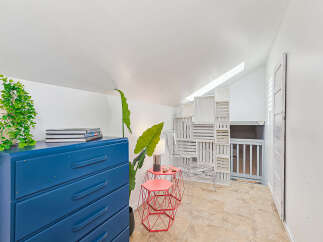 Discover this charming attic space, perfect for a cozy retreat or creative studio.