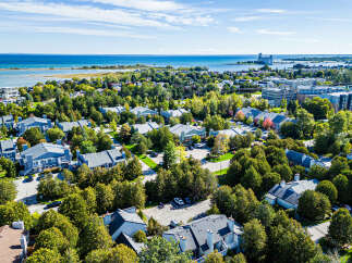 Discover this charming waterfront community offering a blend of modern townhomes and apartments with stunning lake views.