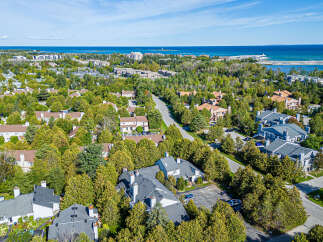 Discover this charming residential neighborhood nestled amongst lush greenery, offering a serene escape with beautiful homes.
