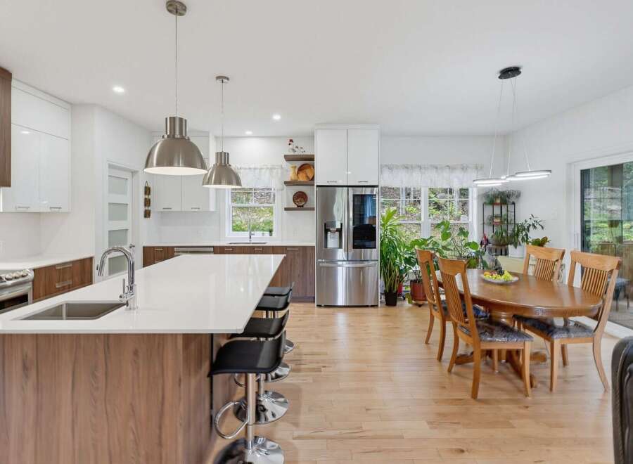 Experience modern living in this spacious open-concept kitchen and dining area, perfect for entertaining.