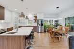 Experience modern living in this spacious open-concept kitchen and dining area, perfect for entertaining.