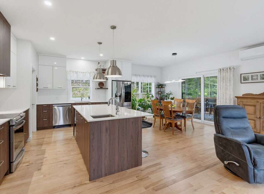 Experience modern living in this open-concept kitchen and dining area, perfect for entertaining.