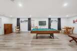 Enjoy endless entertainment in this versatile basement space, featuring a professional-grade pool table perfect for friendly games.