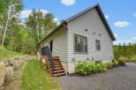 Discover this charming home nestled amidst lush greenery and mature trees, offering a serene retreat.