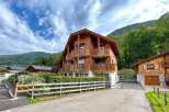 Experience alpine living in this charming wooden chalet, perfect for a mountain getaway.