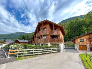 Experience alpine living in this charming wooden chalet, perfect for a mountain getaway.