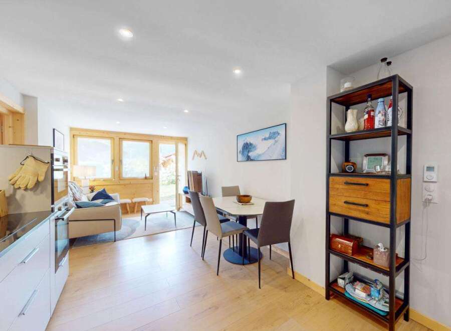 Experience modern living in this beautifully appointed apartment, featuring a spacious open-plan living and dining area perfect for entertaining.