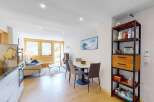 Experience modern living in this beautifully appointed apartment, featuring a spacious open-plan living and dining area perfect for entertaining.