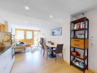 Experience modern living in this beautifully appointed apartment, featuring a spacious open-plan living and dining area perfect for entertaining.