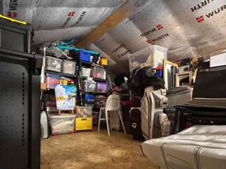 Maximize your storage potential in this spacious attic, perfect for decluttering your home.