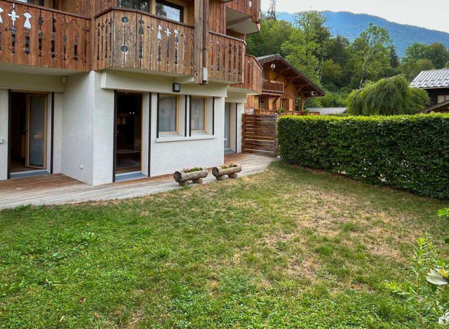 Experience serene mountain living in this charming property featuring a private garden and a wooden balcony perfect for enjoying the fresh air.