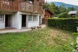 Experience serene mountain living in this charming property featuring a private garden and a wooden balcony perfect for enjoying the fresh air.
