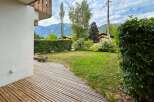 Enjoy the serene mountain views from this charming property, featuring a spacious wooden deck perfect for outdoor relaxation.