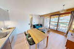 Experience modern living in this beautifully appointed apartment, featuring a sleek, integrated kitchen with a stainless steel sink and induction hob.