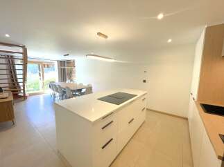 Experience modern living in this spacious open-plan kitchen and dining area, perfect for entertaining.