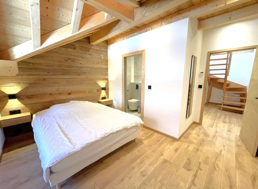 Experience rustic charm and modern comfort in this beautifully appointed bedroom.