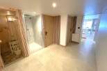 Experience ultimate relaxation in this modern spa area, featuring a private sauna and a spacious walk-in shower.