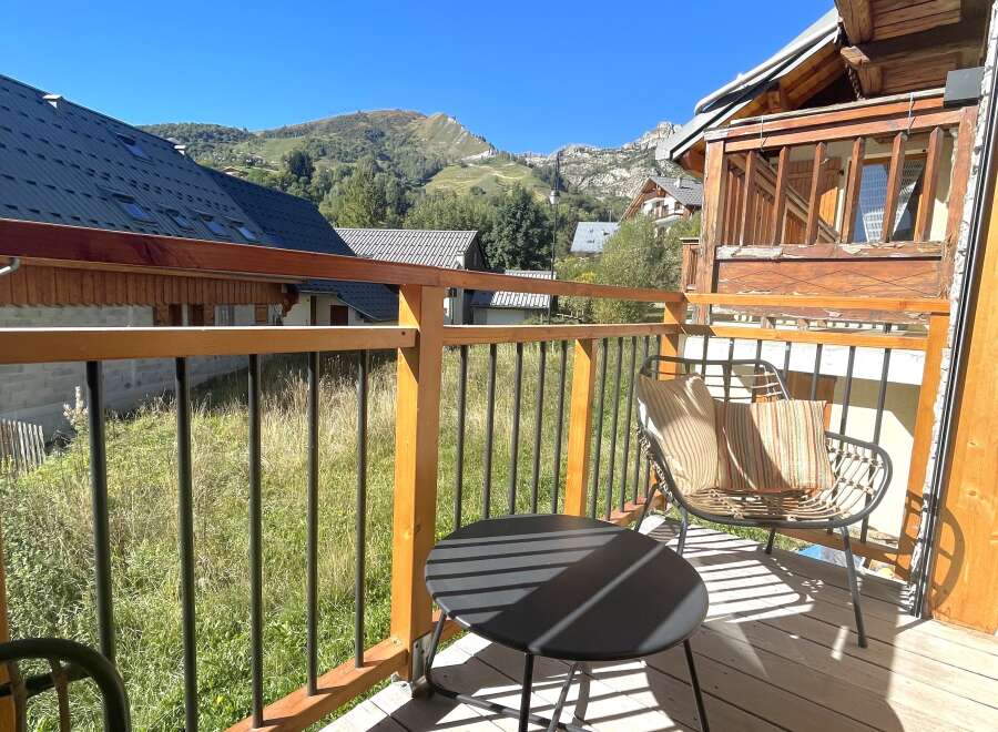 Enjoy breathtaking mountain views from this charming balcony, perfect for morning coffee or evening relaxation.