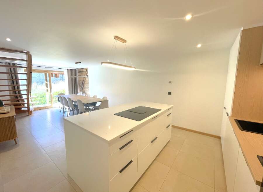 Experience modern living in this spacious open-plan kitchen and dining area, perfect for entertaining.