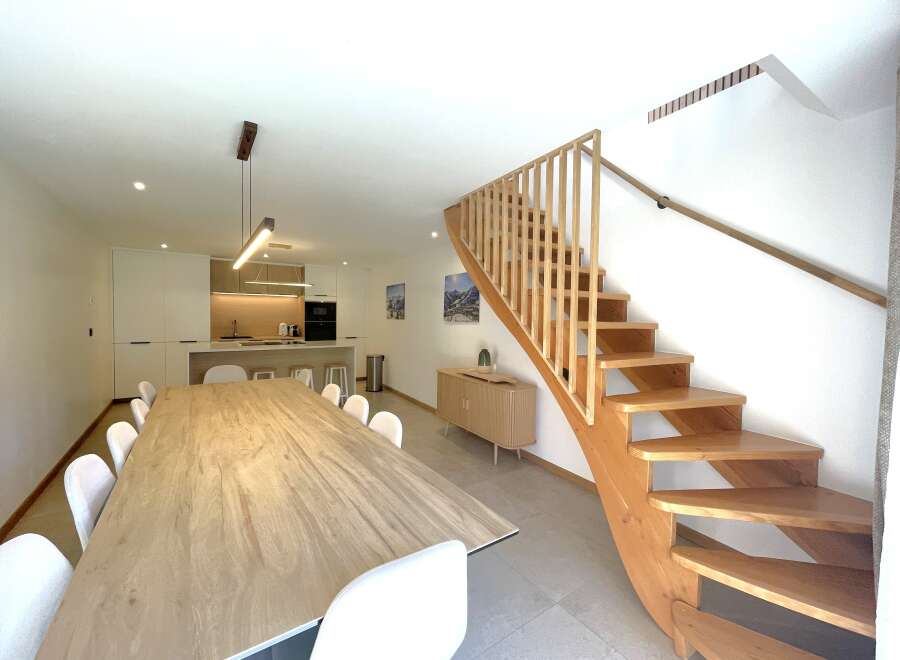 Experience modern living in this spacious open-plan dining and kitchen area, perfect for entertaining.