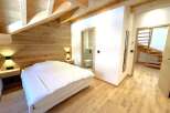 Experience rustic charm and modern comfort in this beautifully appointed bedroom.