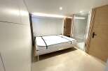 Discover modern living with this innovative Murphy bed setup, perfect for maximizing space in any room.