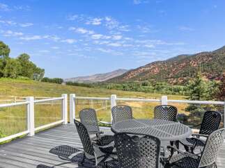 Enjoy breathtaking mountain views from this stunning deck, perfect for outdoor dining and entertaining.